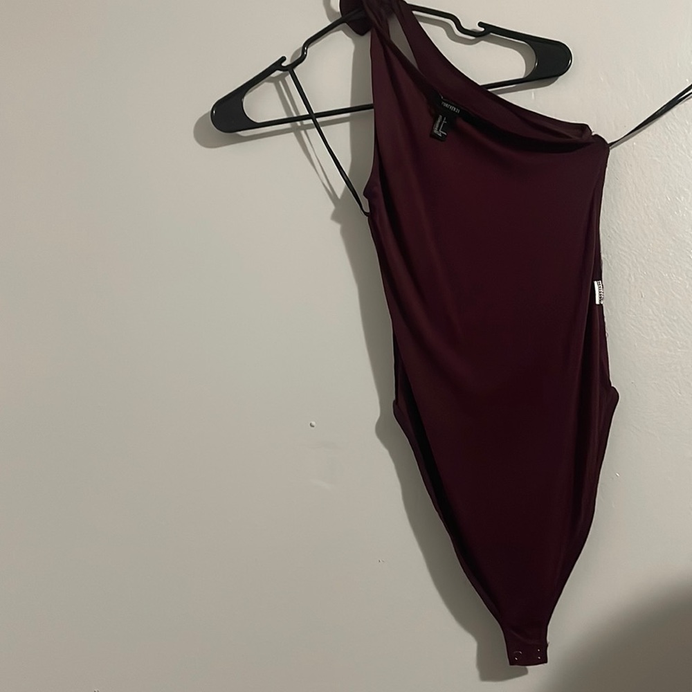Burgendy body suit.